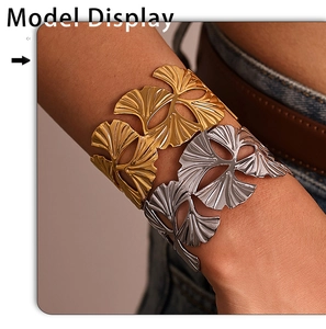 Close-up of ginkgo leaf cuff bracelet with hollow vein details in gold and silver finish