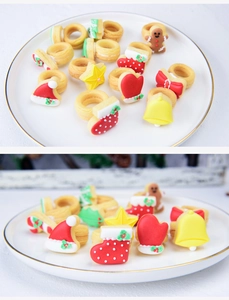 Close-up of colorful Christmas cookie rings with gingerbread man and festive icing details