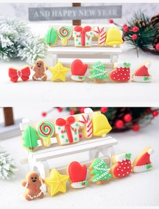 Macro view of 12 mini Christmas cookie fondant cutters including gingerbread man and tree