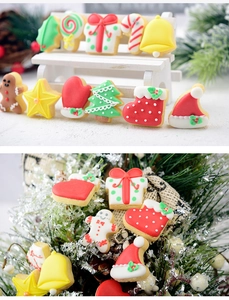 Detailed view of colorful Christmas cookies in ginger man and tree shapes for kids