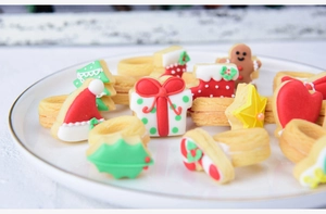 Macro shot of colorful Christmas sugar cookies like gingerbread men and stars