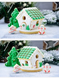 Macro shot of 3D Christmas gingerbread house cookies with festive green and red icing details