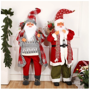 Standing Santa Claus figures with gift bags and bells, festive holiday window ornaments