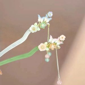 Elegant floral butterfly hair pin with acetate finish and long tassels in retro style