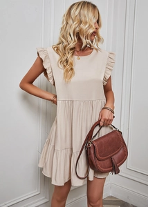 Detail of elegant ruffle sleeves and high waist design on a beige summer dress