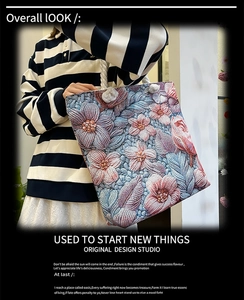 Detail of floral embroidery on canvas tote bag with thick rope handles and vintage style