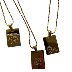 Gold rectangular pendant necklaces with engraved inspirational quotes on bead chains