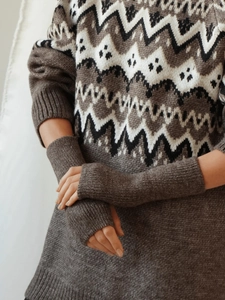 Detail of Fair Isle jacquard knit sweater pattern and matching arm warmers in dark brown
