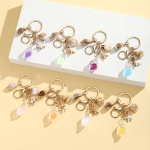 Luminous conch starfish and seashell keychains in multiple colors for beach vacation vibes