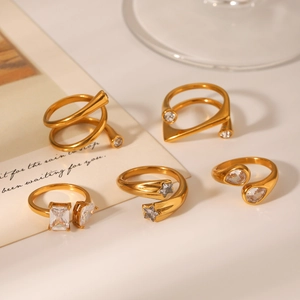 Macro detail of 18K gold plated stainless steel rings with sparkling zircon inlays