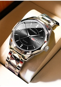 Detail of quartz watch dial with diamond markers, calendar window and silver band