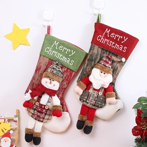 Christmas stockings set with Santa and Snowman hanging decorations for holiday gifts