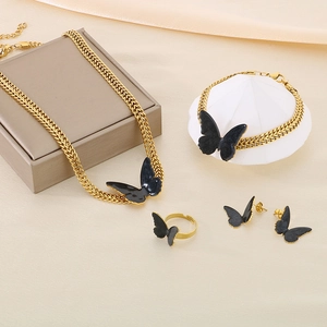 Elegant gold butterfly jewelry set including necklace, bracelet, ring and earrings
