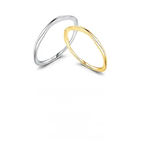 Close-up of S925 sterling silver stamp on minimalist irregular wavy rings set
