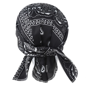 Close-up of black durag with white paisley pattern showing tail ties and stitching detail