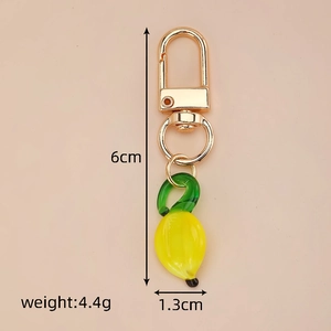 Banana glass keychain detail with 6cm size and 4.4g weight specifications shown