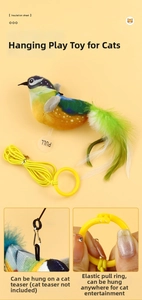 Detail showing elastic pull ring and metal hook of the chirping bird cat toy
