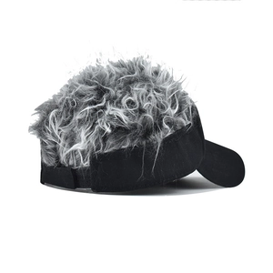 Detail of adjustable velcro strap and grey synthetic wig on black baseball cap