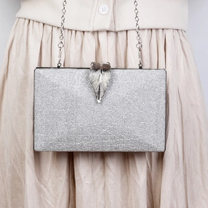 Silver leaf evening clutch bag with metallic texture and delicate chain strap for women