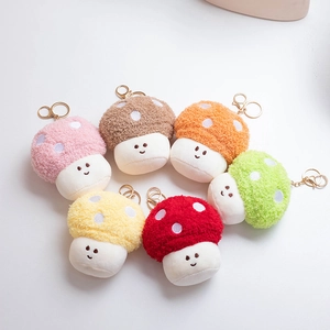 Set of six colorful plush mushroom keychains with polka dots and golden metal clips
