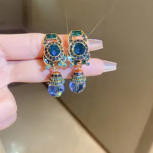 French vintage baroque style gold earrings with blue crystals and teardrop pendant