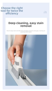 Close-up of a 2-in-1 window groove cleaning brush tool with a grey fiber brush head