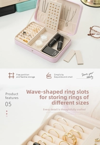 Detail of pink faux leather jewelry box with velvet ring slots and necklace hooks