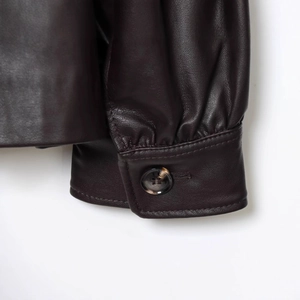 French retro dark brown leather jacket with stand collar and detailed lantern sleeves