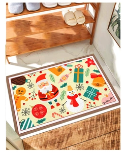 Detailed view of a Christmas doormat with Santa and snowman patterns on a tiled floor