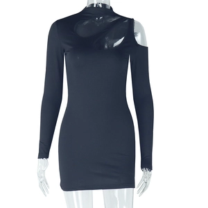 Detail view of black bodycon dress with asymmetric cutout neckline and long sleeves