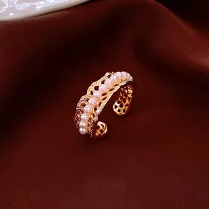 18K gold plated pearl hollow open ring with French vintage style on brown silk