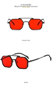 Detail view of octagon geometric sunglasses with black metal frame and red lenses