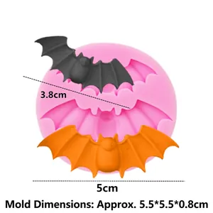Pink silicone Halloween bat mold for fondant and baking with black and orange bats
