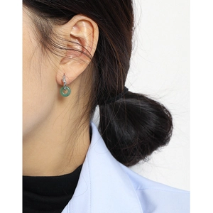 Elegant S925 sterling silver knot earrings with green round jade pendant on model