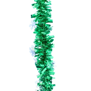 Close-up of sparkling green Christmas tinsel with white snowflake details on white background