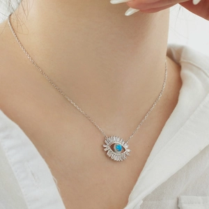 Close-up of S925 sterling silver Evil Eye necklace with blue gemstone and zircons