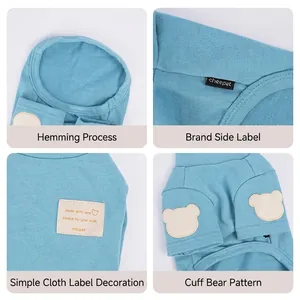 Blue knit dog sweater with bear patch and detailed hem for small dogs like Bichon