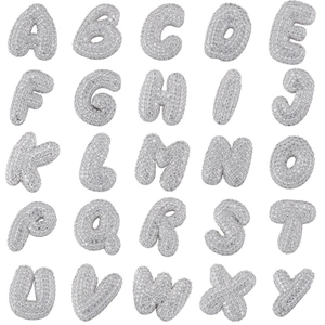 Silver balloon style alphabet pendant set with sparkling cubic zirconia on white background