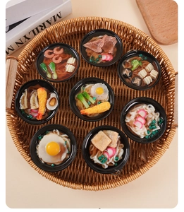 Macro detail of eight assorted miniature Japanese udon and ramen bowls in a woven basket