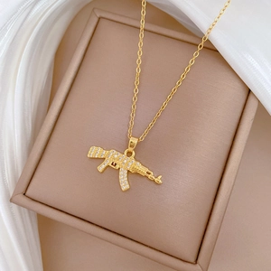 Luxurious gold stainless steel necklace with sparkling crystal encrusted rifle pendant