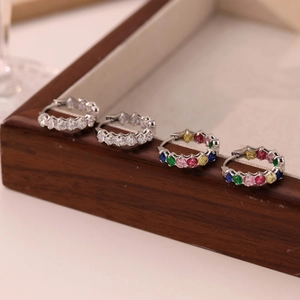 French style hoop earrings with rainbow crystals and silver plating on dark wood
