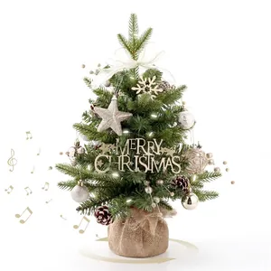 Rotating musical mini Christmas tree with warm LED lights and rustic burlap base décor