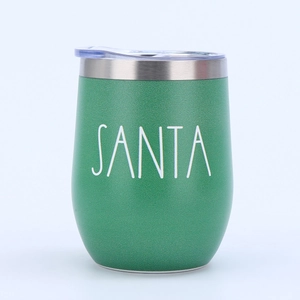Close-up of green 12oz stainless steel egg tumbler with Santa print and clear lid