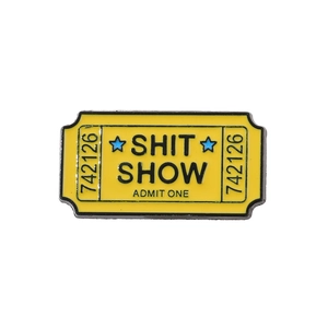 Vintage style yellow enamel ticket pin with Shit Show text for clothing and backpacks