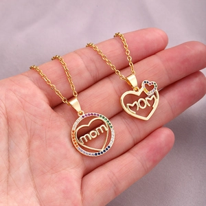 Close-up of gold Mom pendant necklaces with colorful cubic zirconia inlays