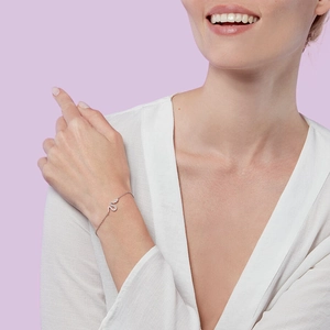 Retro S925 sterling silver snake chain bracelet with sparkling zircons on female wrist