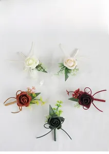 Detailed set of multi-color PE rose wedding corsages with berries and silk ribbons