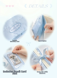 Detail of blue striped fabric journal cover with ribbon bow and card slot