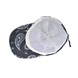 Detail view of cotton paisley baseball cap showing 100% polyester mesh lining and sweatband