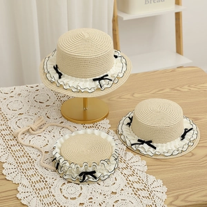 Sweet straw hat and matching bag set with white lace trim and black bows for sun protection